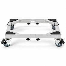 A silver metal dolly frame with four black caster wheels and textured black rubber pads on the top, shown on a clean white background.
