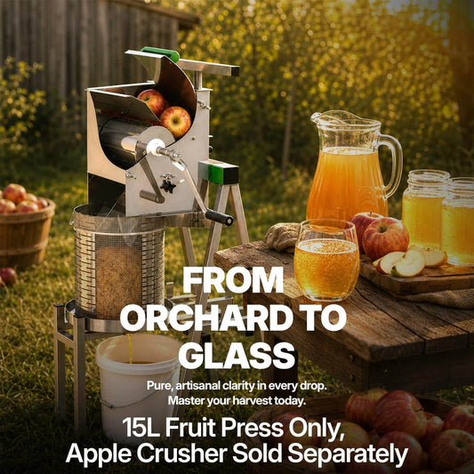 Fruit press with apples, juice glasses, and a pitcher outdoors.
