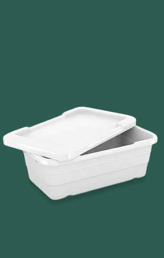 White plastic container with lid on a green background