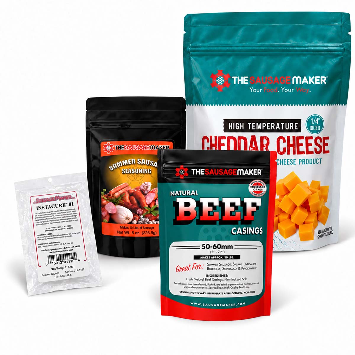 A product bundle from The Sausage Maker, including a large bag of cheddar cheese, a black pouch of summer sausage seasoning, a small white packet of instant cure, and one pack of natural beef casings, arranged on a white background.