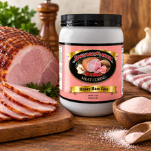 A jar of Sausage Maker Honey Ham Cure meat curing salt displayed on a rustic wooden table with a sliced ham, salt bowls, and kitchen props.