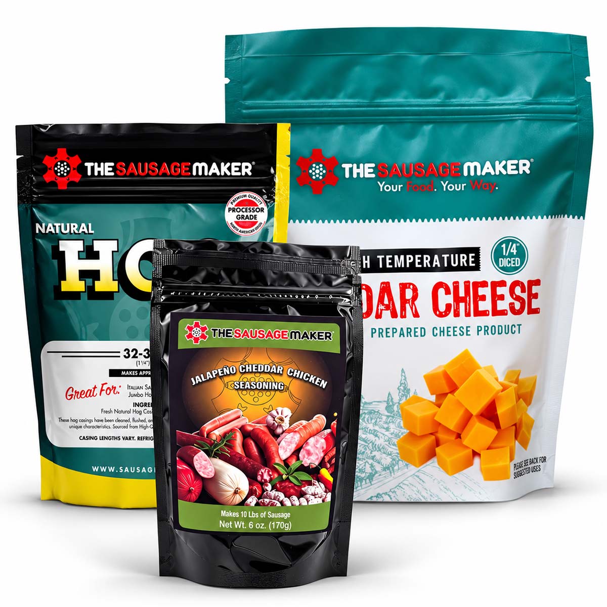 Three Sausage Maker branded packaged food products arranged together on a white background: a large high-temp cheddar cheese bag, natural hog casings, and a black 6 oz jalapeño cheddar seasoning bag pouch in front.