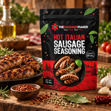 A stand-up pouch of The Sausage Maker Hot Italian Sausage Seasoning stands on a rustic wooden table with grilled sausage, spices, garlic, herbs, and tomatoes around it.